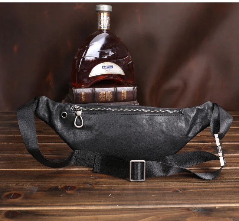A premium black leather sports waist pack with multiple pockets and an adjustable strap for hands-free mobility and convenience.