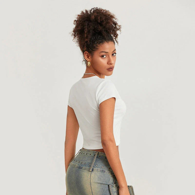 A vibrant t-shirt featuring a floral and disco ball print, perfect for summer festivals and casual outings.