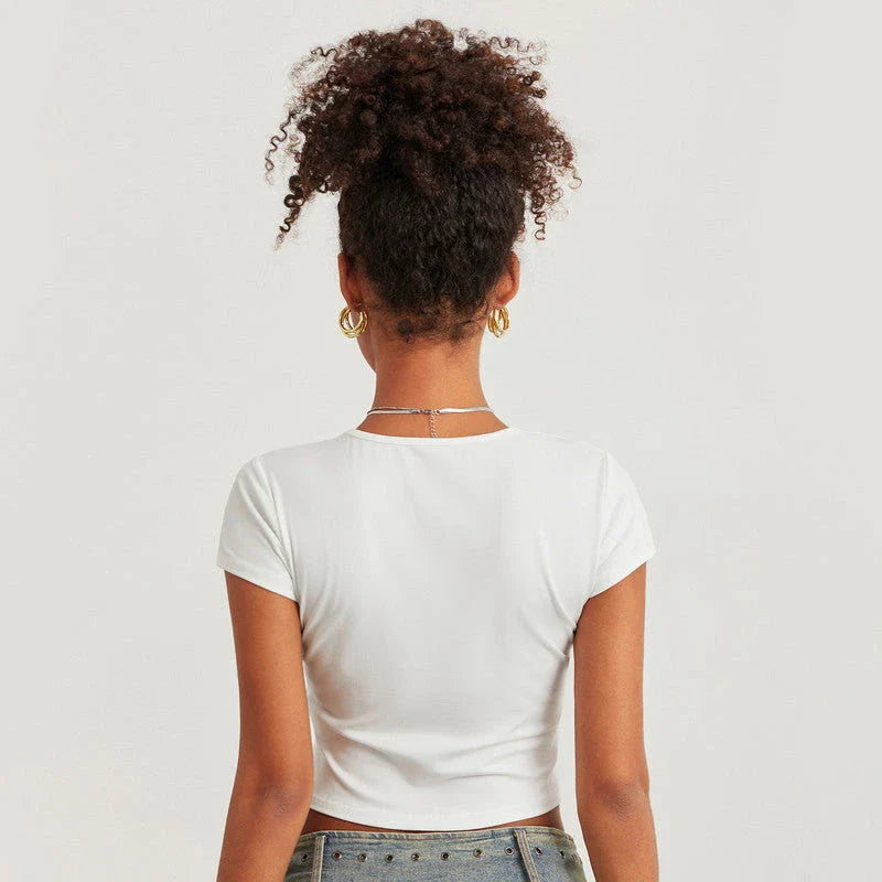 A vibrant t-shirt featuring a floral and disco ball print, perfect for summer festivals and casual outings.