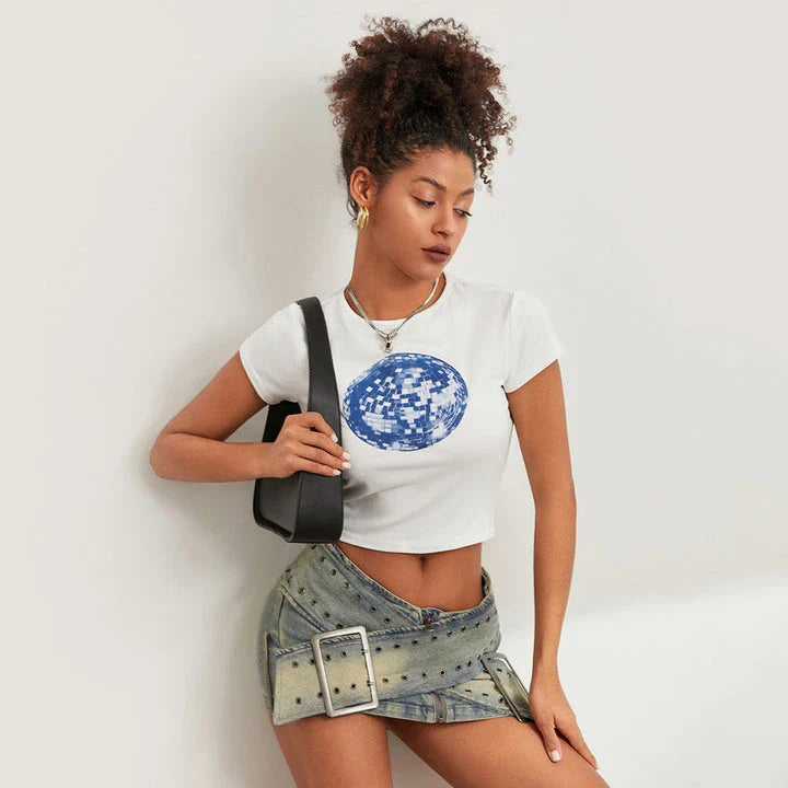 A vibrant t-shirt featuring a floral and disco ball print, perfect for summer festivals and casual outings.