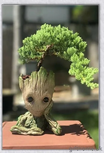 Decorative Groot-themed ceramic planter pot for displaying houseplants or organising desks
