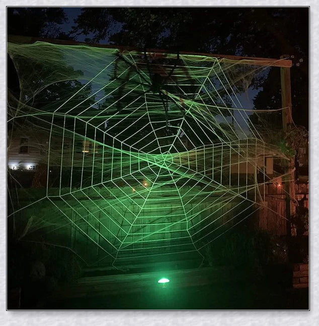 Massive black and white Halloween spider web decoration that stretches across large areas, creating a haunting atmosphere