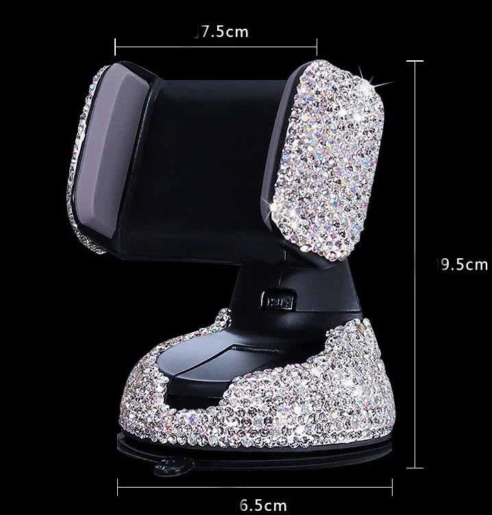 Diamond-encrusted car phone holder mounted on air vent with phone securely in place