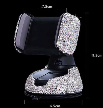 Diamond-encrusted car phone holder mounted on air vent with phone securely in place