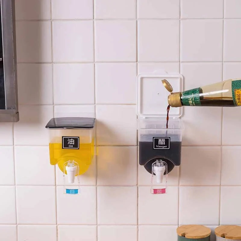 Wall-mounted condiment bottles in white and black, featuring press handle for easy pouring