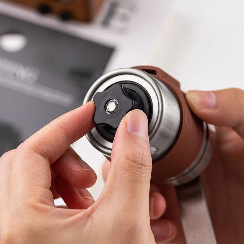 Portable hand coffee machine with stainless steel grinder and folding handle