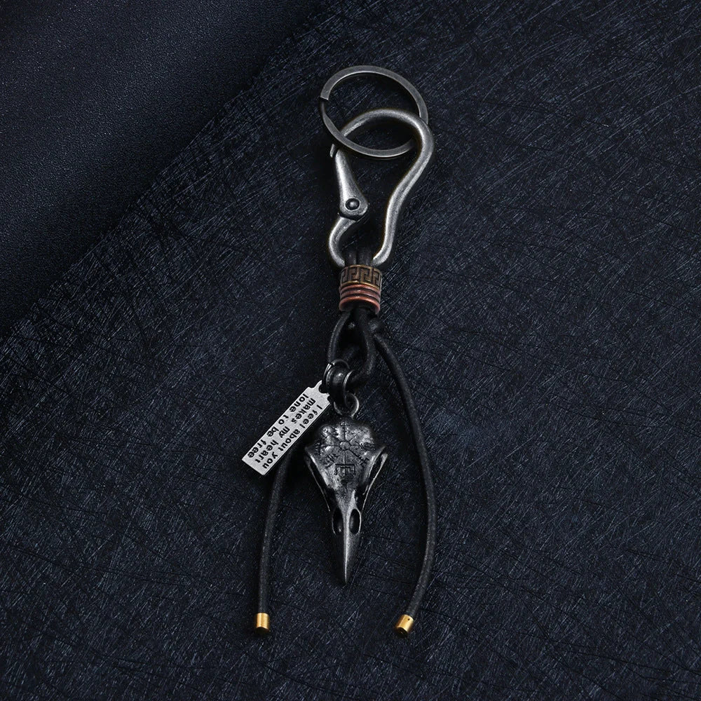 Retro leather keychain with lobster clasp and skull motif in bronze and silver