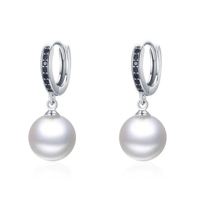 Trendy copper ball stud earrings with a minimalist design, showcasing a sleek and modern accessory for fashion-forward women