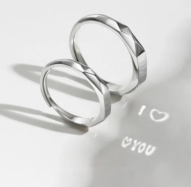Stylish sterling silver rings with a hidden love pattern design, perfect for romantic gifts or personal accessorizing.