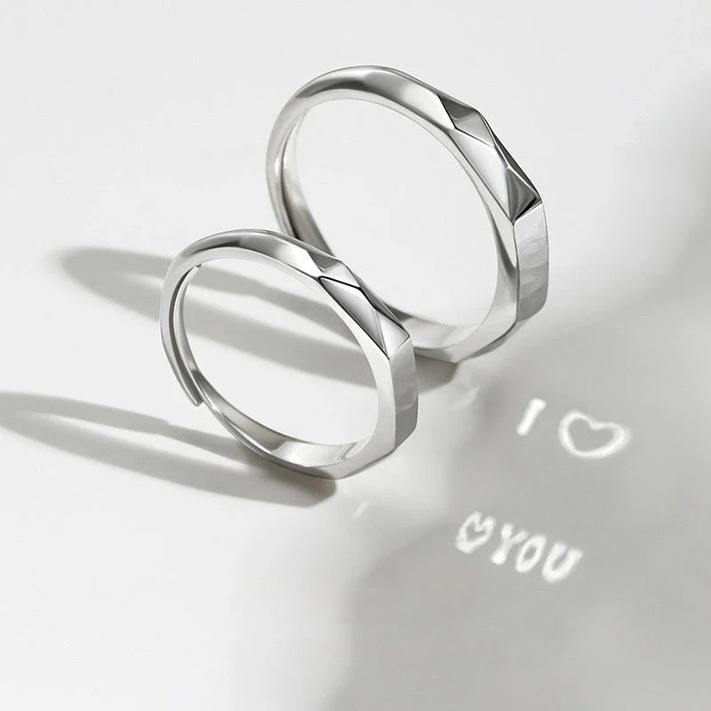 Stylish sterling silver rings with a hidden love pattern design, perfect for romantic gifts or personal accessorizing.
