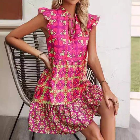 Stylish sleeveless dress with v-neck, lace-up detailing, and vibrant digital printing for a chic summer look