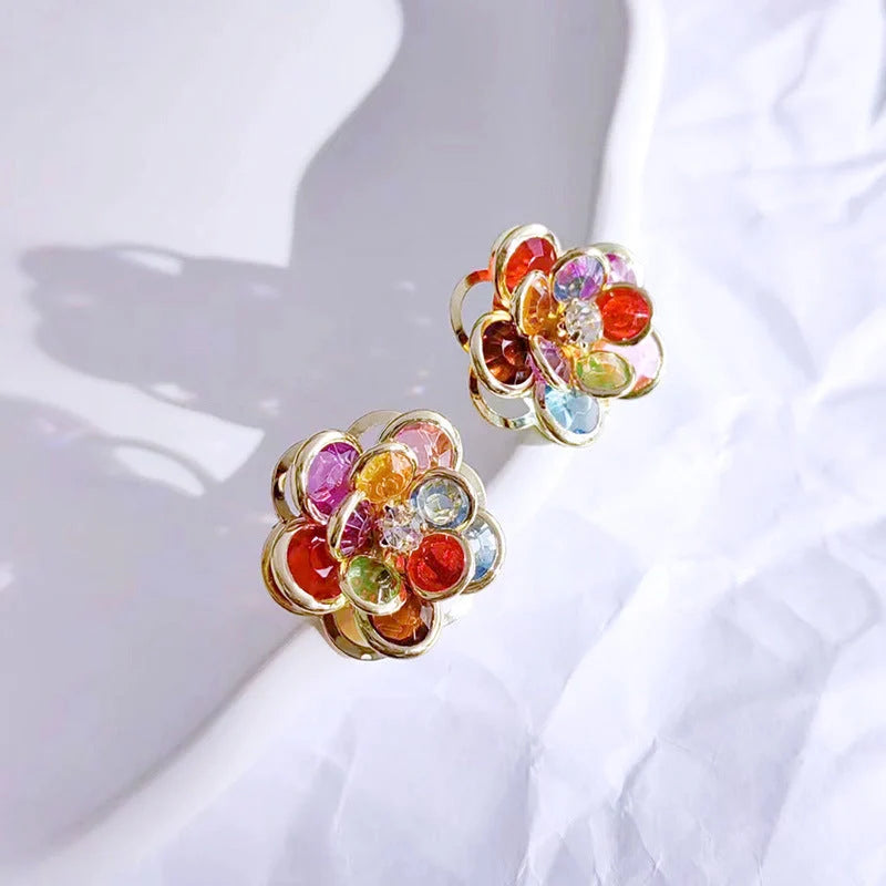 Small flower stud earrings for women in colour, black, and white options - sweet and trendy design