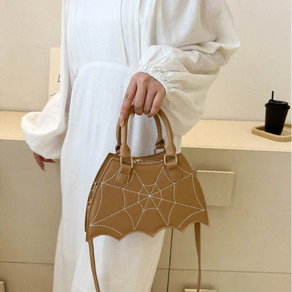 Trendy spider web-patterned shoulder bags in various colours, perfect for adding a spooky-chic touch to your Halloween outfit