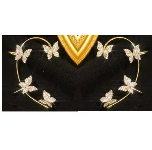 Chic butterfly ear clips in gold and silver tones, featuring a unique and elegant design for fashion-forward style.