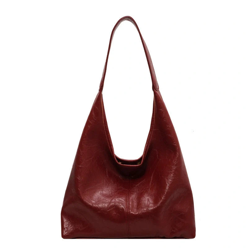 Elegant vintage designer women's shoulder bag in various colours