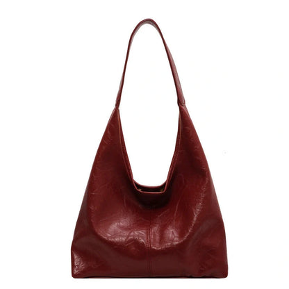 Elegant vintage designer women's shoulder bag in various colours