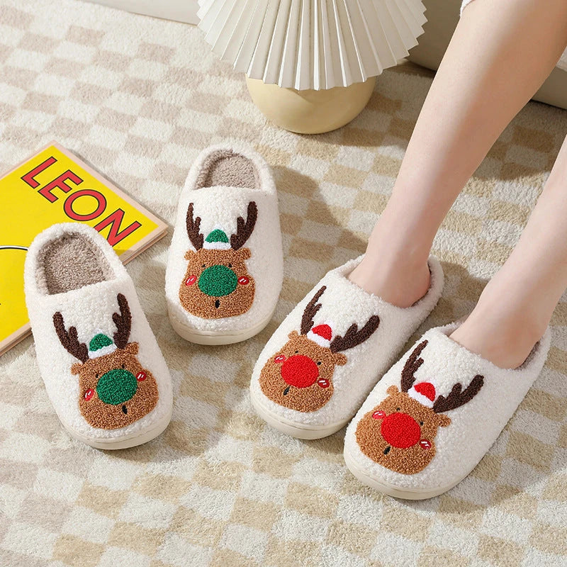 Cozy elk-themed slip-on house slippers in festive red and green colors with plush, soft materials for comfortable holiday relaxation