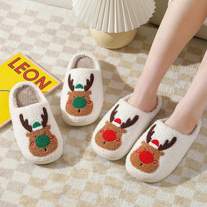 Cozy elk-themed slip-on house slippers in festive red and green colors with plush, soft materials for comfortable holiday relaxation