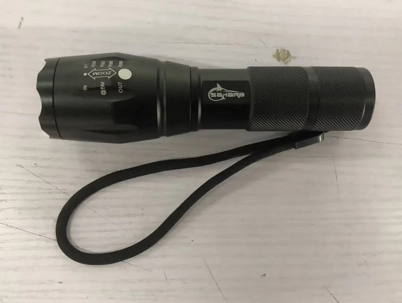 High-powered outdoor LED flashlight with adjustable beam and durable aluminum alloy construction