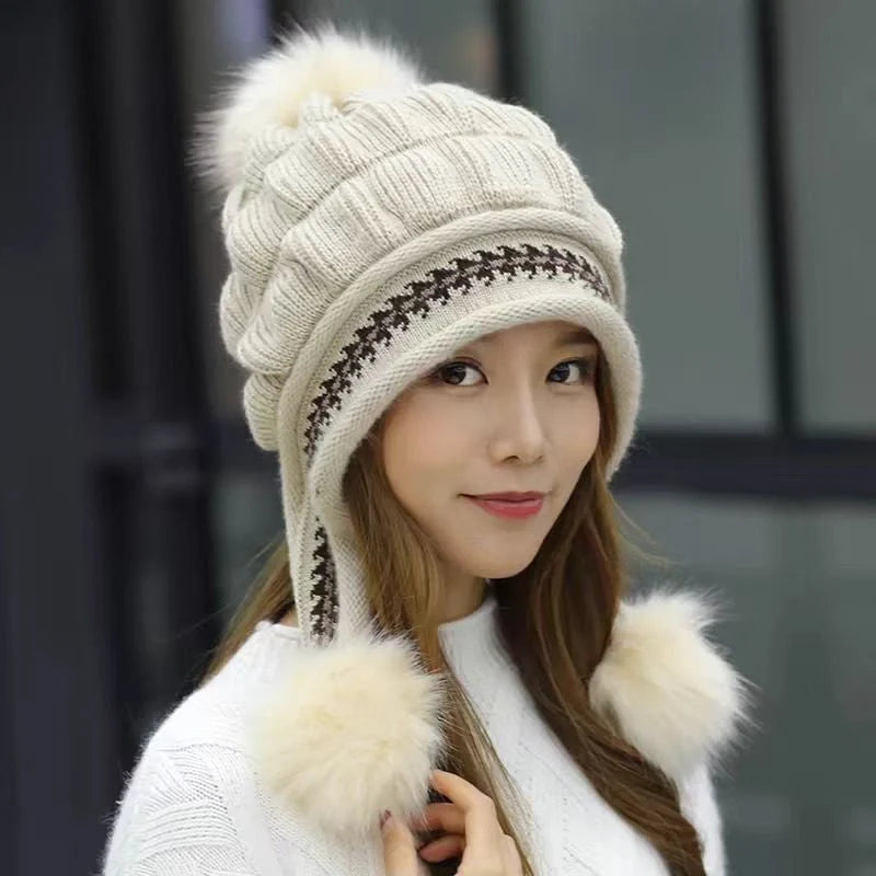 Knit fleece beanie with ear flaps and pompom in various colours for winter warmth