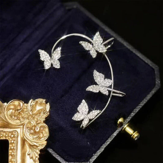 Chic butterfly ear clips in gold and silver tones, featuring a unique and elegant design for fashion-forward style.
