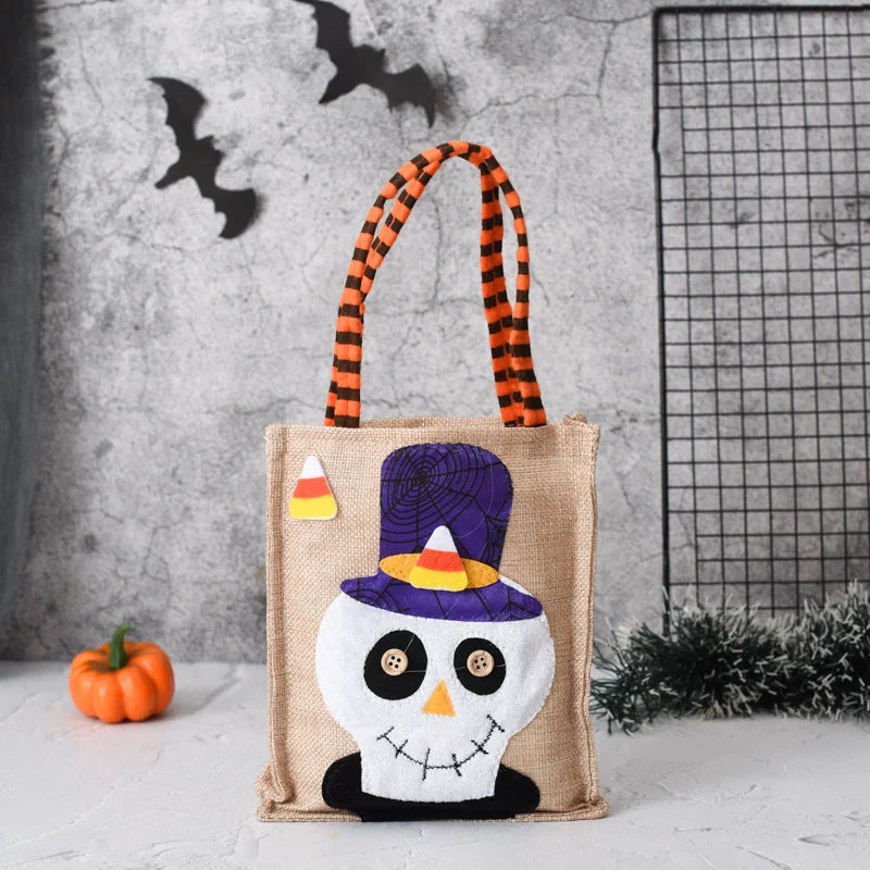 Halloween themed tote bag for kids featuring witch, skull, and pumpkin designs