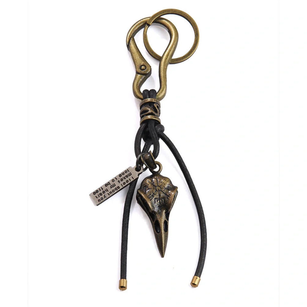 Retro leather keychain with lobster clasp and skull motif in bronze and silver