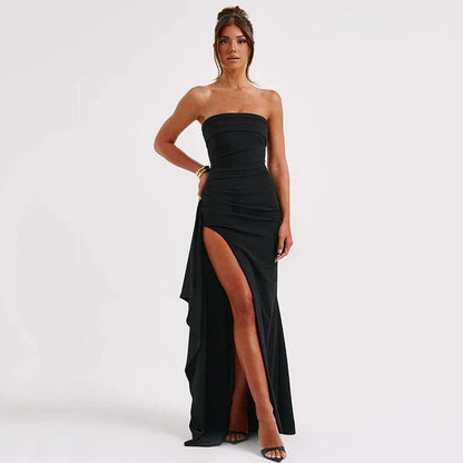 Stunning backless maxi dress in various colors, featuring a pleated A-line skirt and strapless silhouette for elegant occasions.