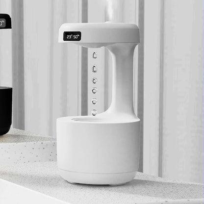 Anti-gravity humidifier with LED display and aroma diffuser in white, green, and black