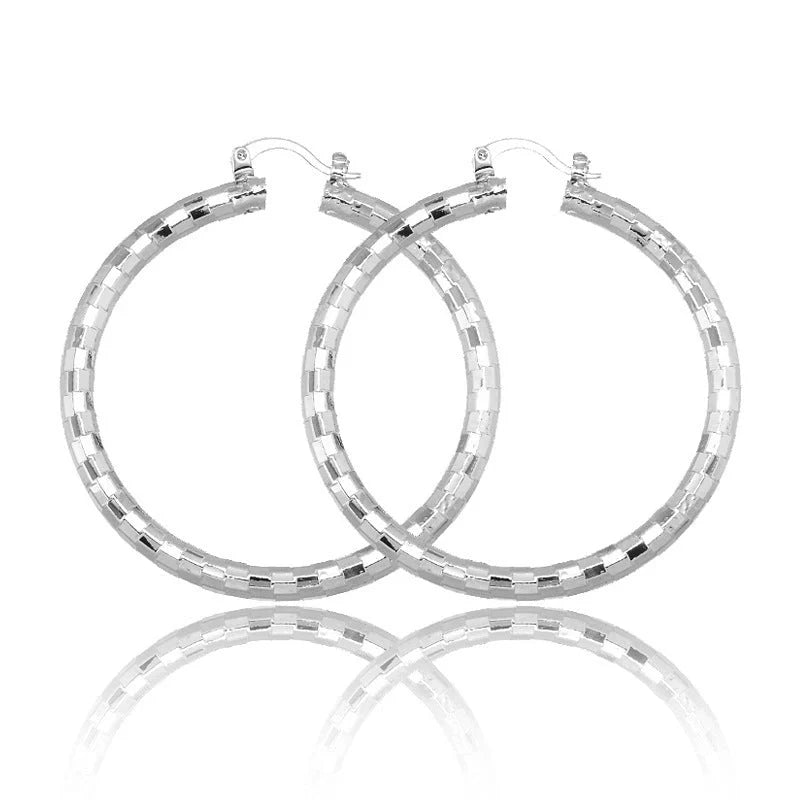 Elegant gold-plated minimalist circular earrings with a sophisticated British design