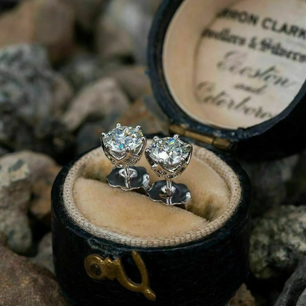 Elegant six-claw diamond zircon ear studs in white gold-toned finish, a fusion of traditional and contemporary style