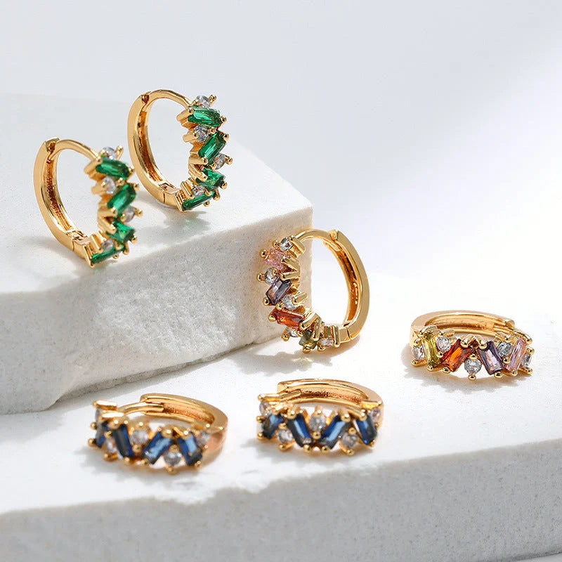 Elegant leaf-patterned ear clips with zircon and emerald gemstones, crafted in premium 18-carat gold-plated copper