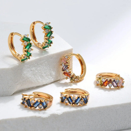Elegant leaf-patterned ear clips with zircon and emerald gemstones, crafted in premium 18-carat gold-plated copper
