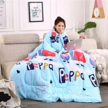 Cozy quilted lounger with sleeves in various colors and sizes, perfect for year-round indoor comfort and relaxation.
