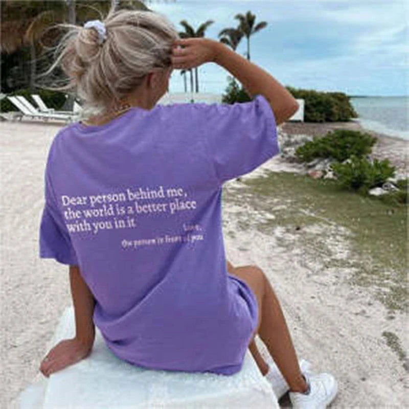 Women's graphic tee with playful slogan, available in various colors and sizes