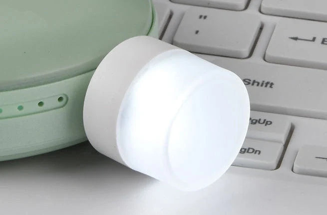 Compact USB LED night light with soft glow for reading and sleep