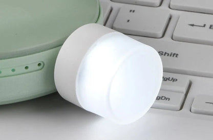 Compact USB LED night light with soft glow for reading and sleep