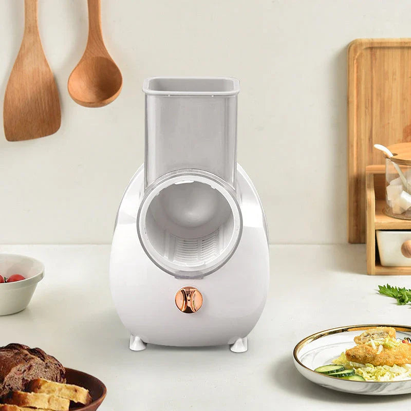 Electric Vegetable Slicer with Interchangeable Blades, Suction Base, and Compact Design for Efficient Meal Prep