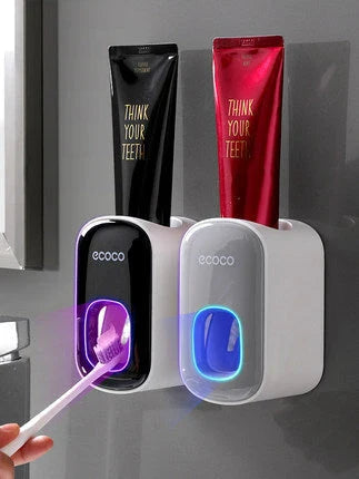 Wall-mounted automatic toothpaste dispenser with storage cups for toothbrush and bathroom accessories
