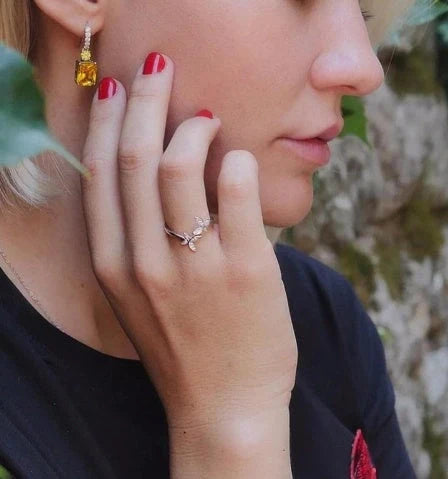 Sterling Silver Adjustable Butterfly Ring with gem accents on a white background
