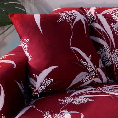 Stretchable geometric print sofa cover on a three-seater sofa