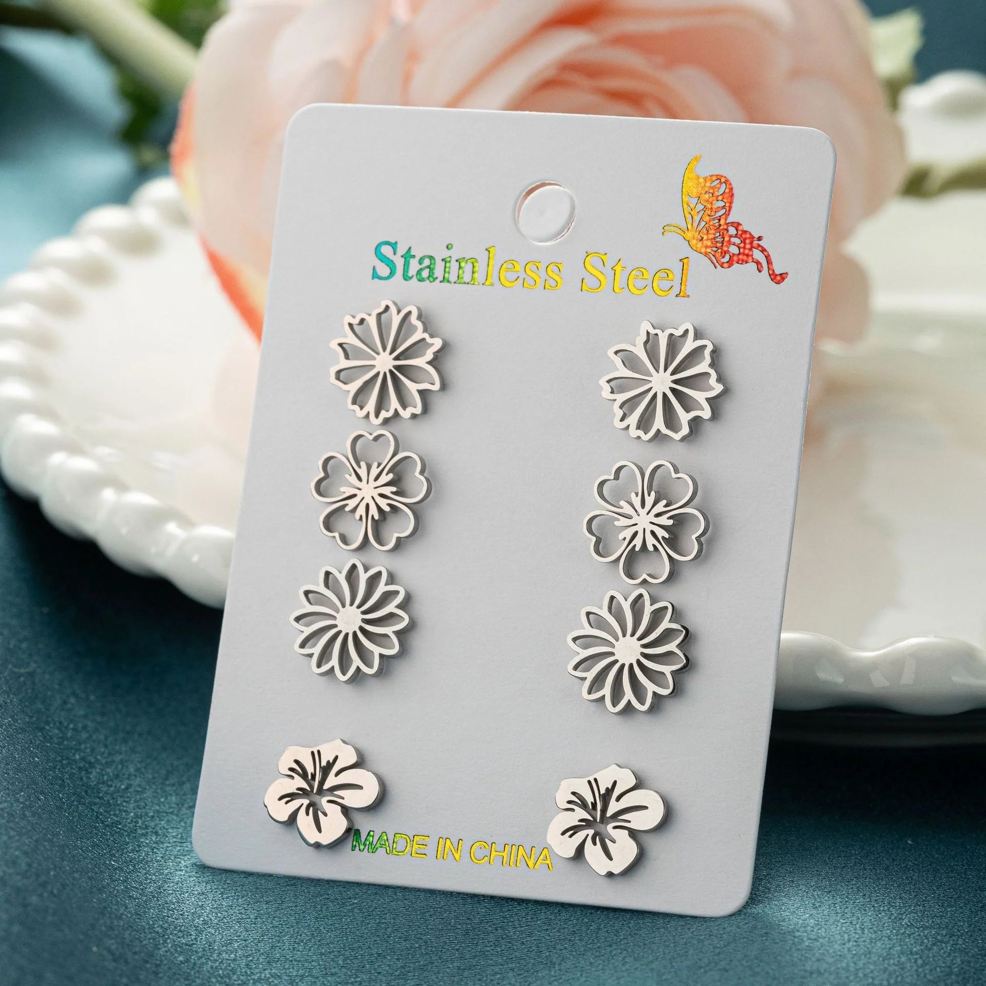 Fashion simulation stud earrings in gold, steel, rose gold, and black
