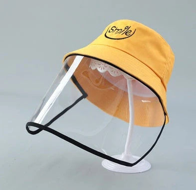 Child wearing anti-spitting protective hat with transparent bezel