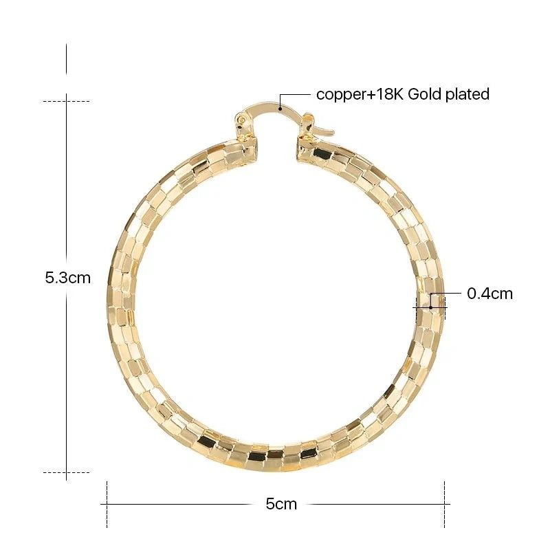 Elegant gold-plated minimalist circular earrings with a sophisticated British design