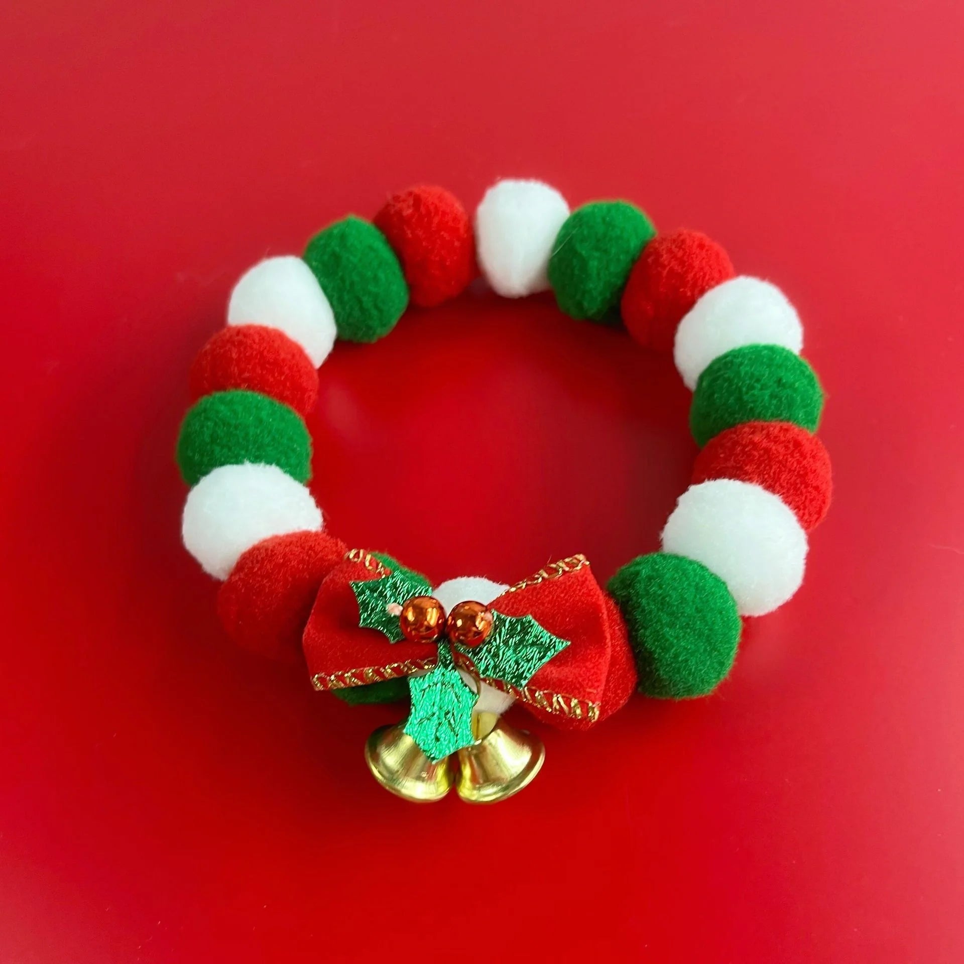 Festive plush ball pet collar with elastic fit for Christmas in green and golden leaves designs