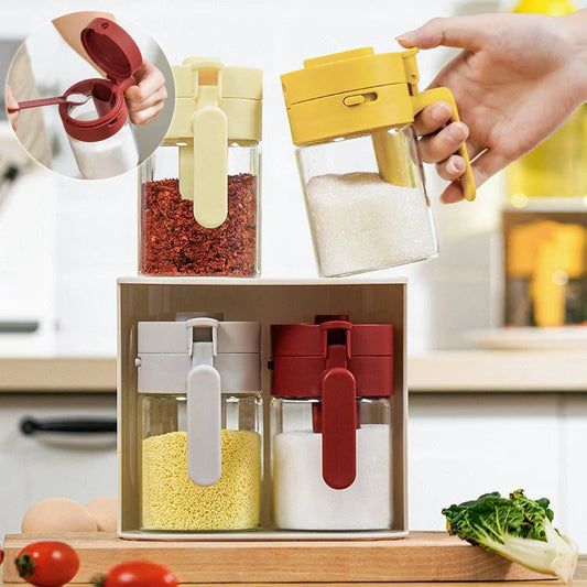 Small glass seasoning jars with lids and built-in spoons for easy measuring and storage