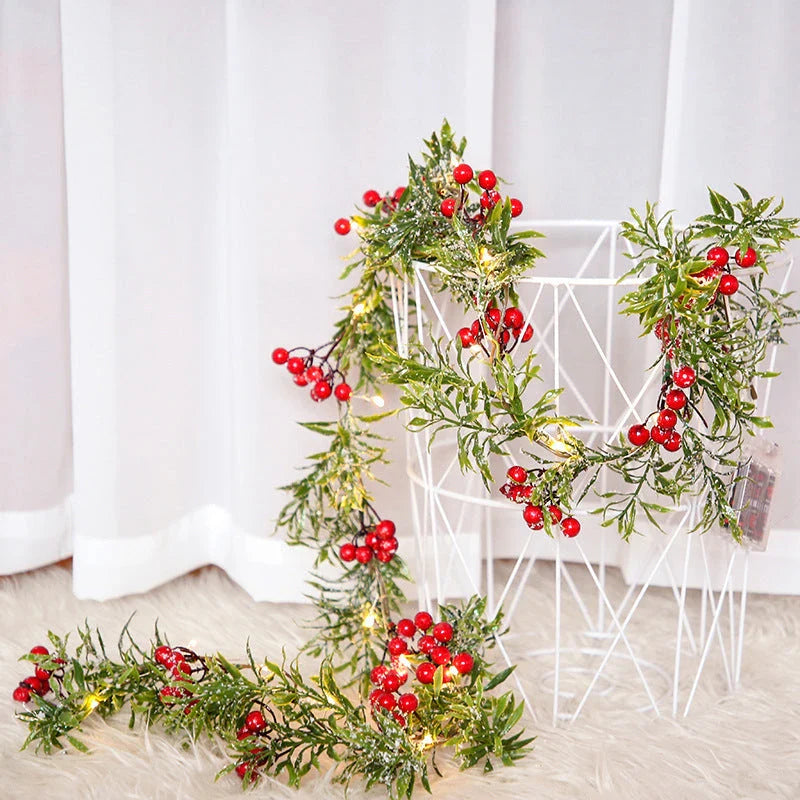 Festive Christmas lights with a decorative leaf garland, creating a cosy, enchanting display for the holiday season