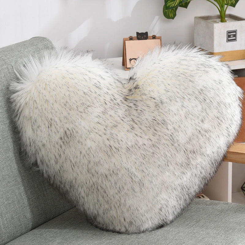 Cozy heart-shaped throw pillow with plush, shaggy texture in various colors