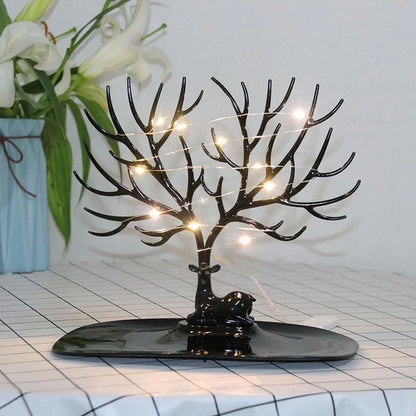 Deer Antler Jewelry Stand in white and black, displaying necklaces and earrings