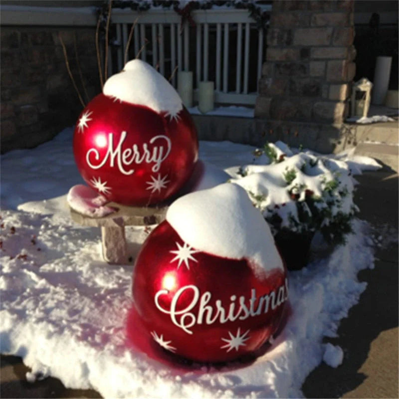 Vibrant inflatable Christmas baubles in a variety of colours and patterns, perfect for outdoor holiday decoration
